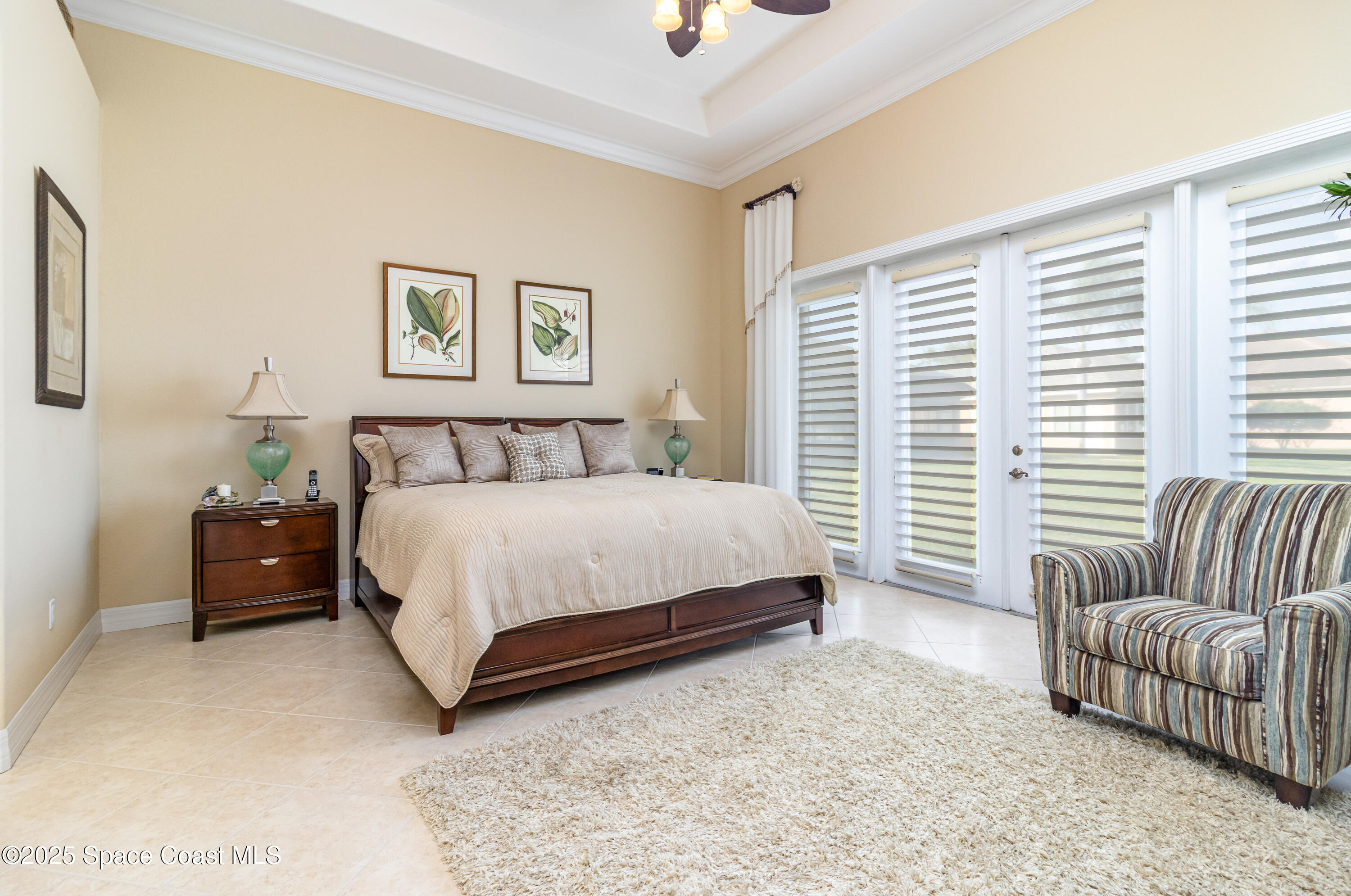 200 Harmony Lane Titusville, FL 32780 - Photo 17 of 28 a bedroom with a bed and a couch