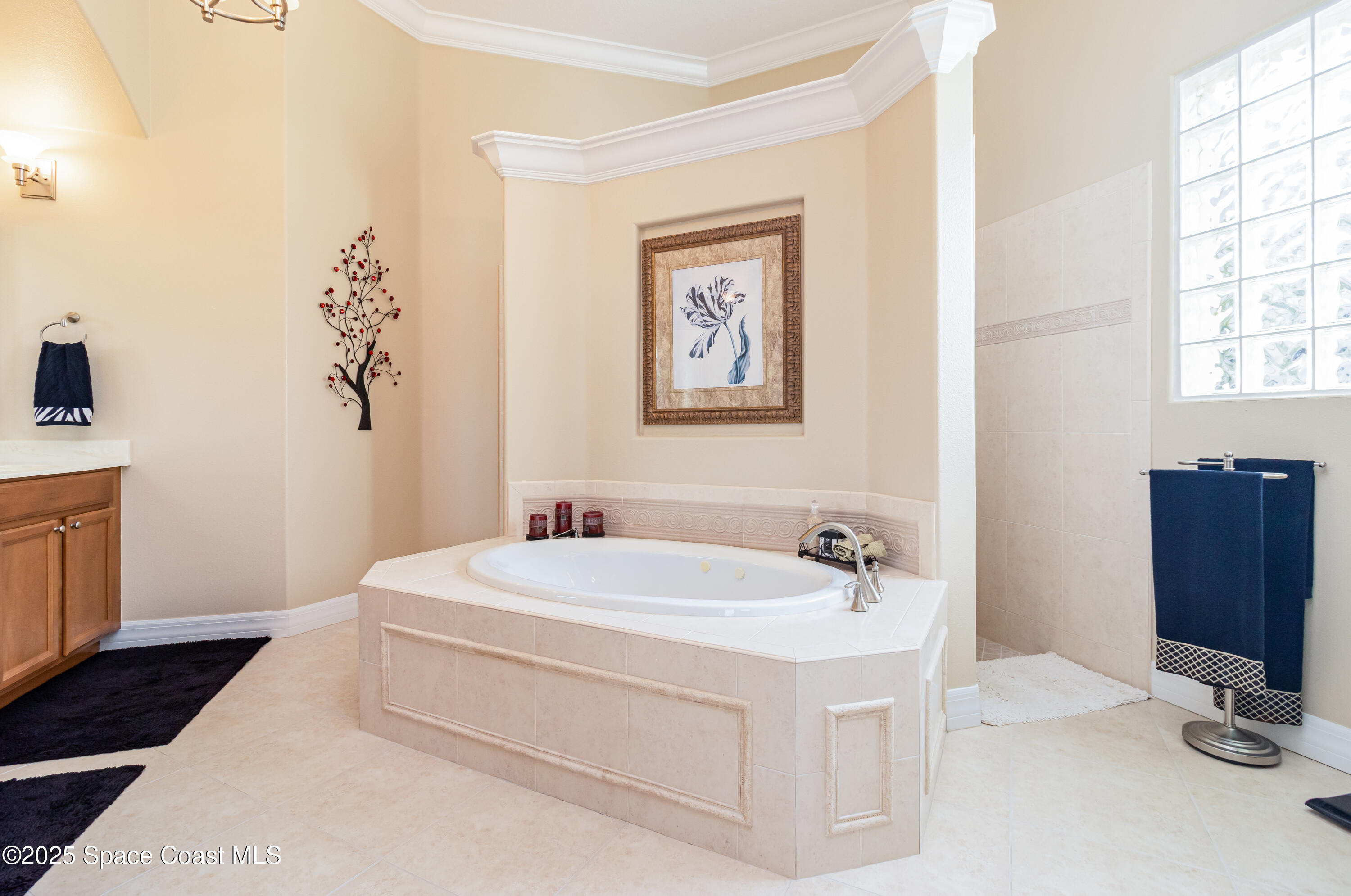 200 Harmony Lane Titusville, FL 32780 - Photo 19 of 28 a bathroom with a sink and a mirror