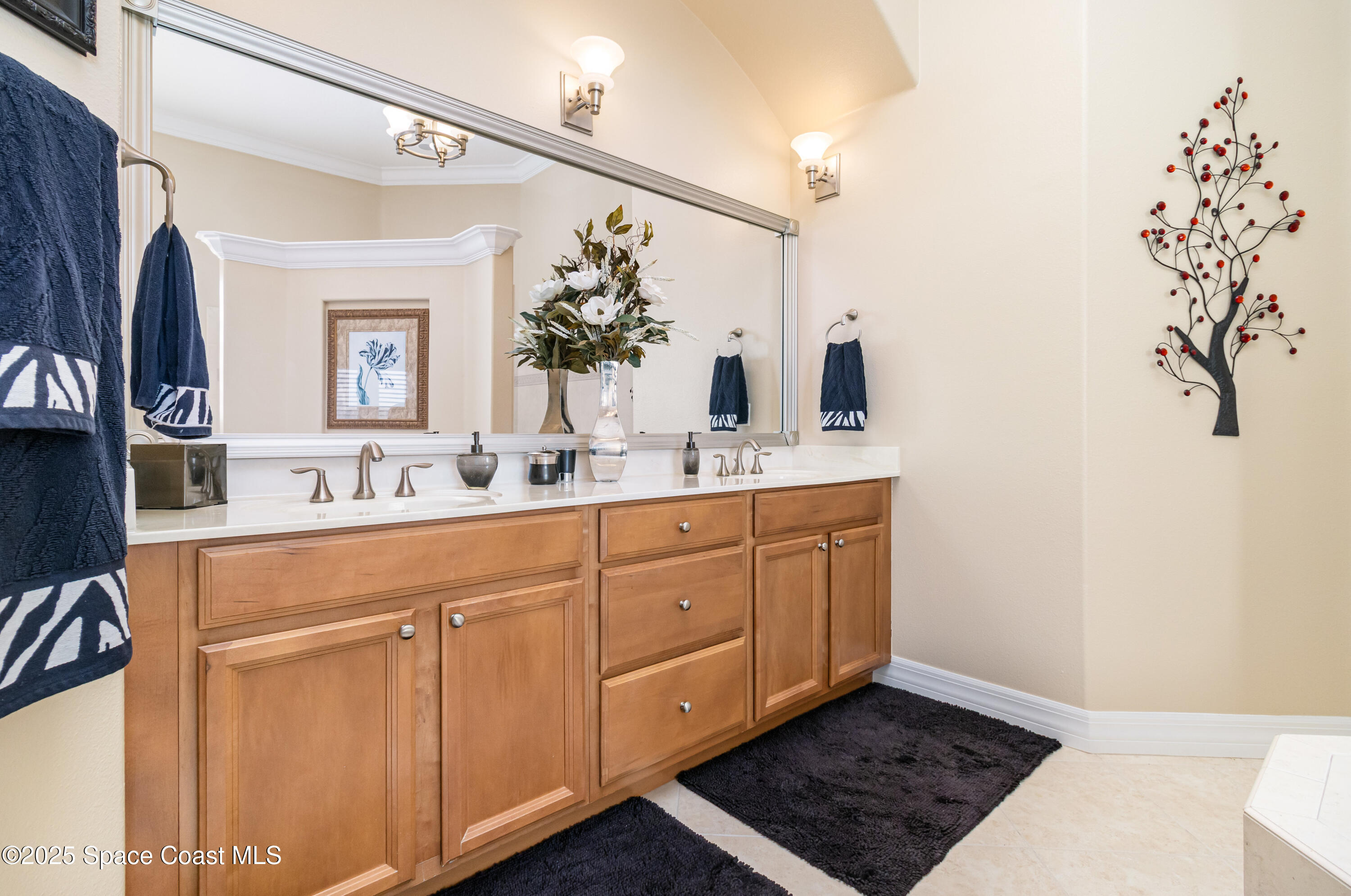 200 Harmony Lane Titusville, FL 32780 - Photo 20 of 28 a bathroom with a sink and a mirror