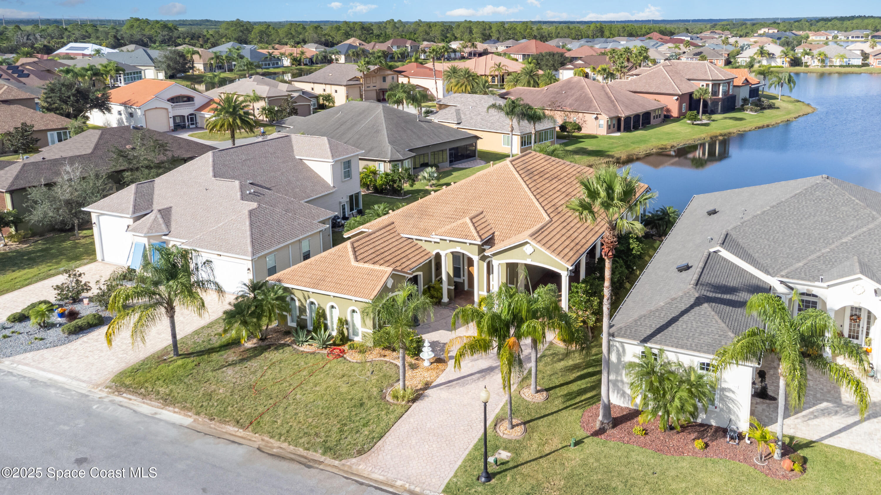 200 Harmony Lane Titusville, FL 32780 - Photo 2 of 28 an aerial view of residential houses with outdoor space and ocean view