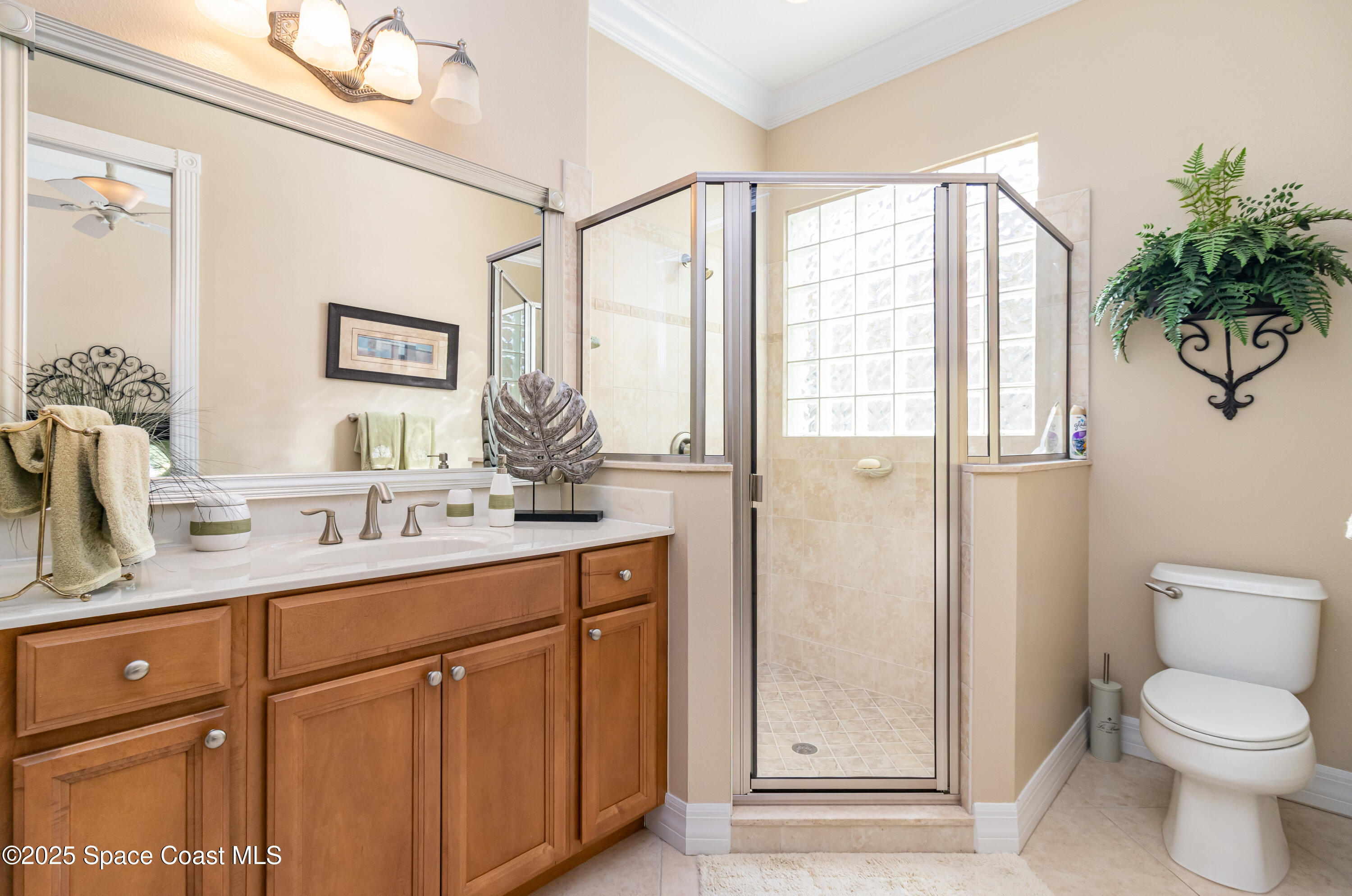 200 Harmony Lane Titusville, FL 32780 - Photo 23 of 28 a bathroom with a granite countertop sink toilet and shower