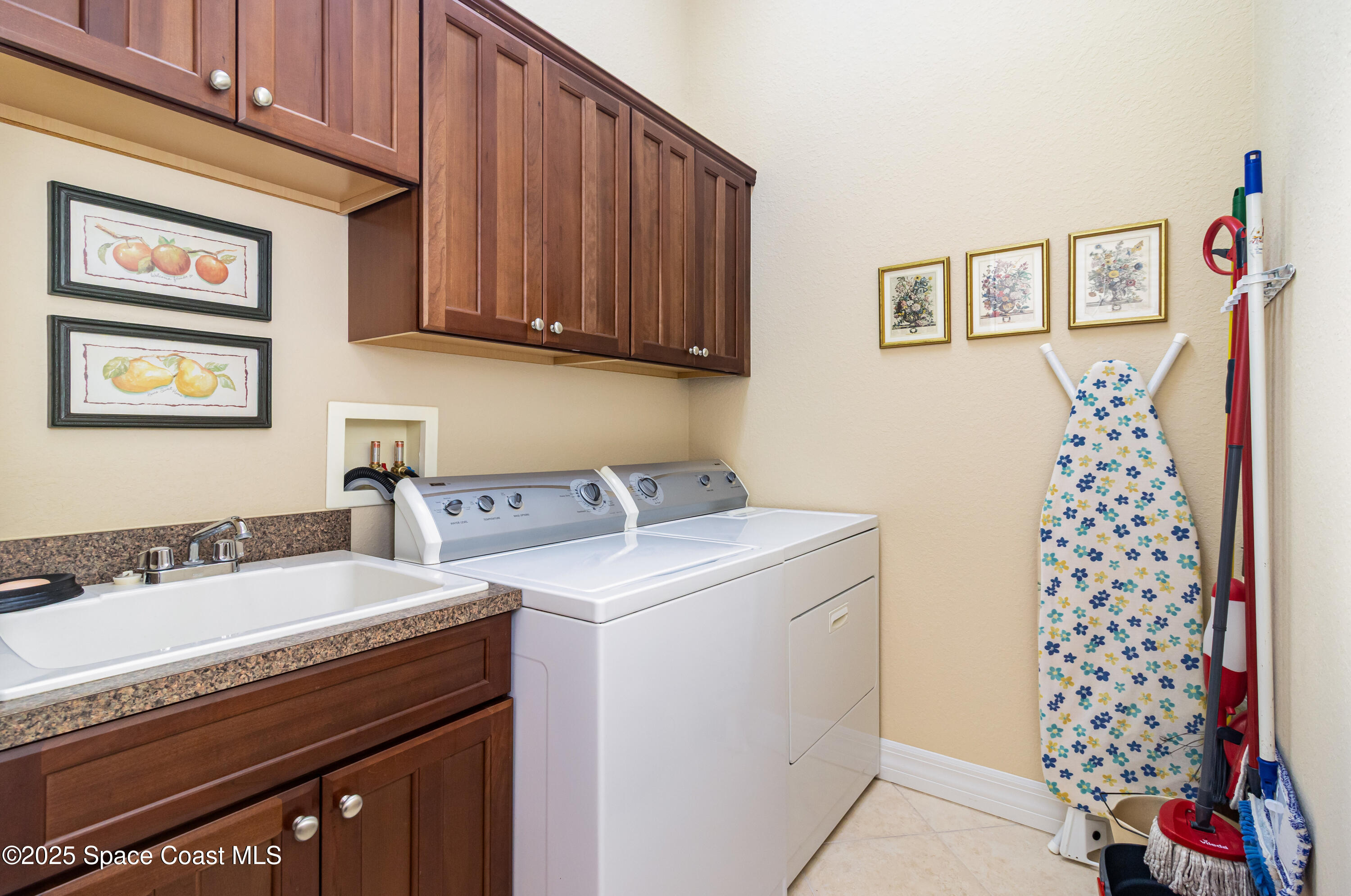 200 Harmony Lane Titusville, FL 32780 - Photo 24 of 28 a utility room with dryer and washer