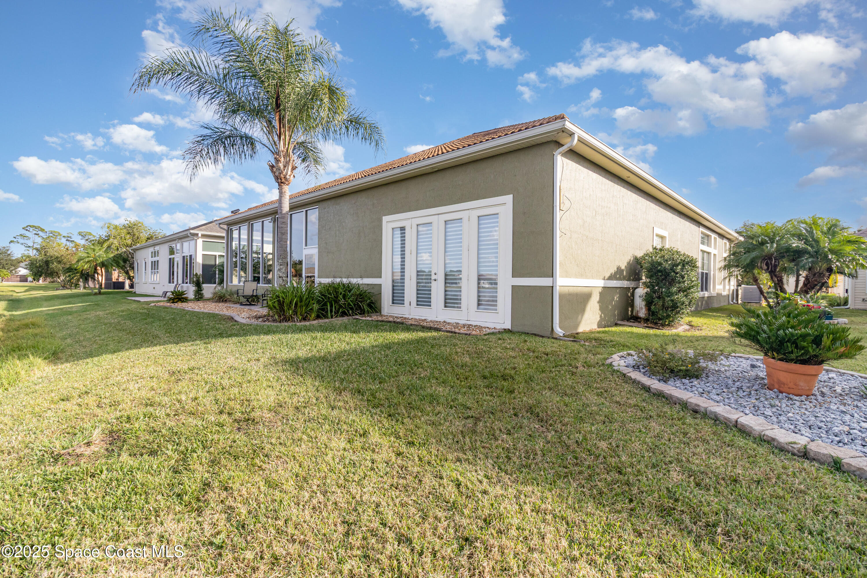 200 Harmony Lane Titusville, FL 32780 - Photo 26 of 28 a view of a house with backyard and garden