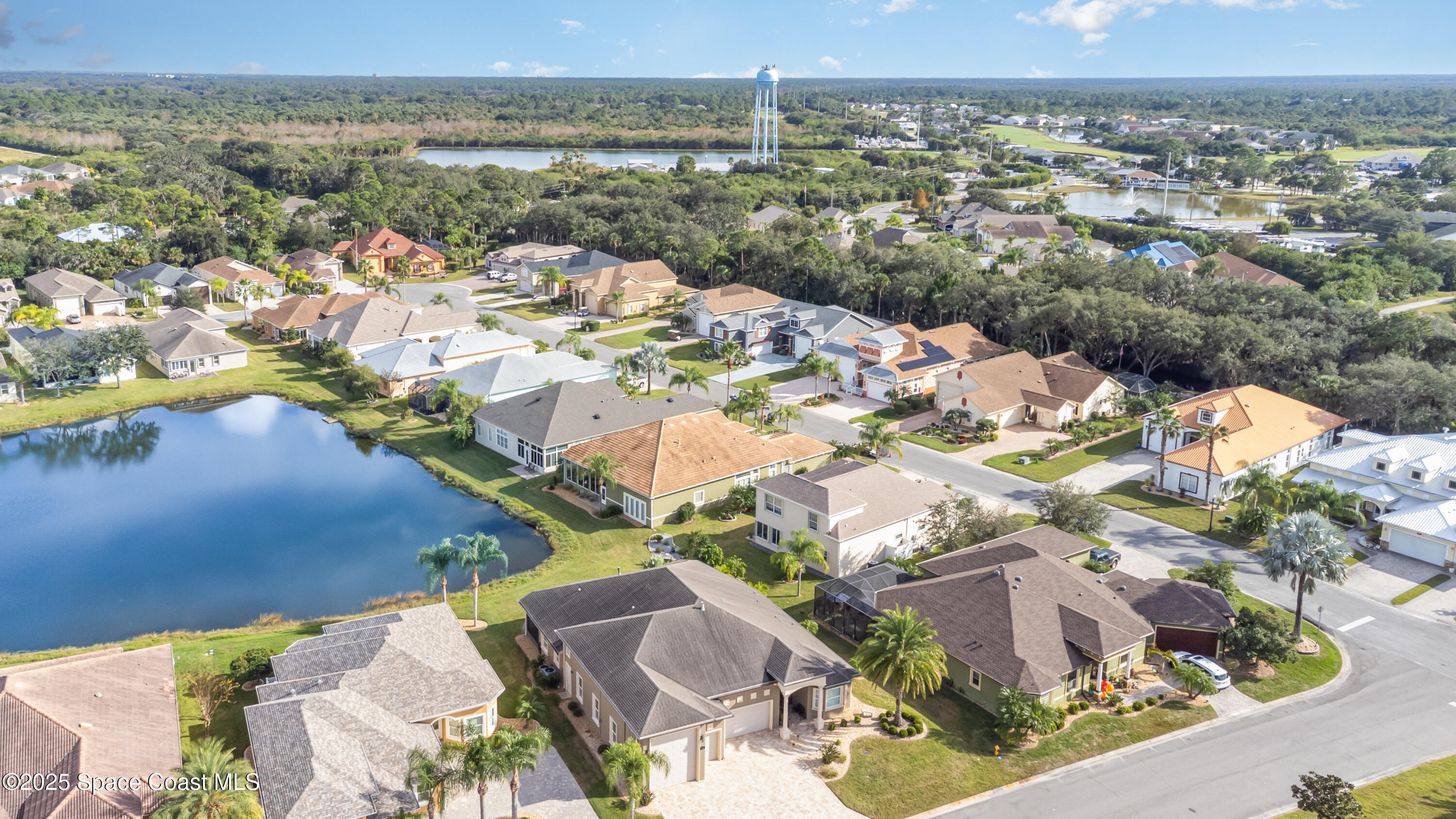 200 Harmony Lane Titusville, FL 32780 - Photo 28 of 28 an aerial view of residential houses with outdoor space