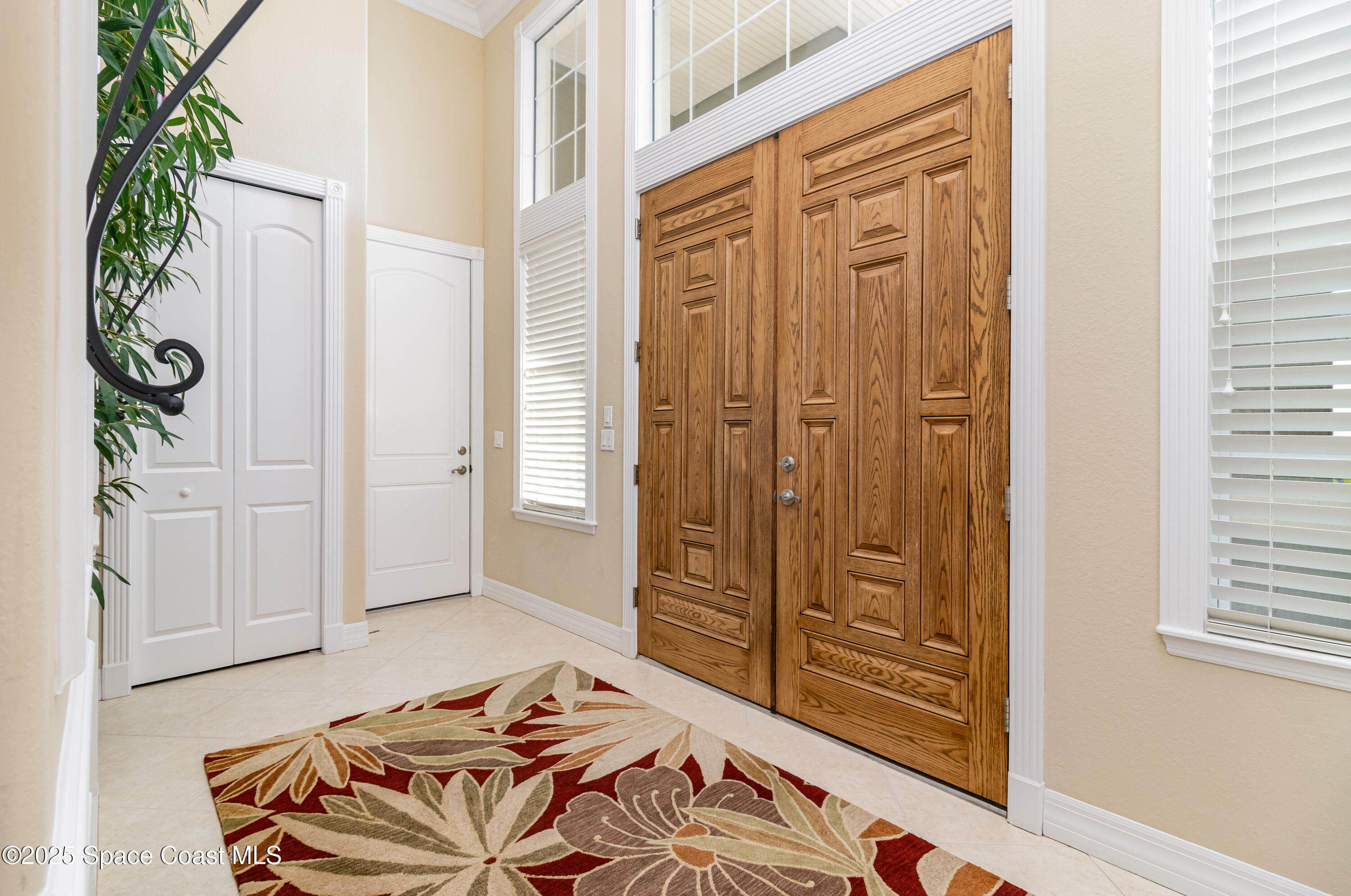 200 Harmony Lane Titusville, FL 32780 - Photo 5 of 28 a bedroom with a bed and a closet