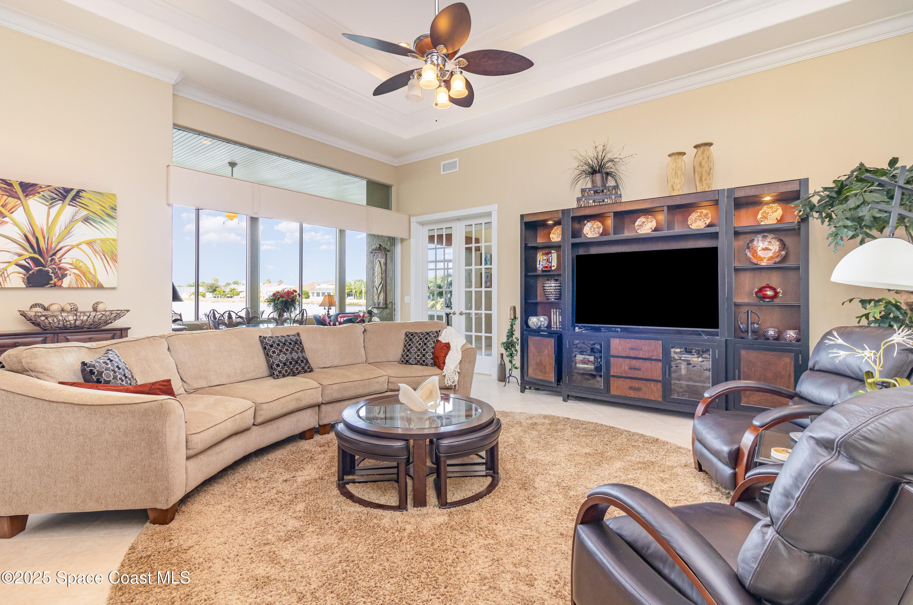 200 Harmony Lane Titusville, FL 32780 - Photo 6 of 28 a living room with furniture a flat screen tv and a window