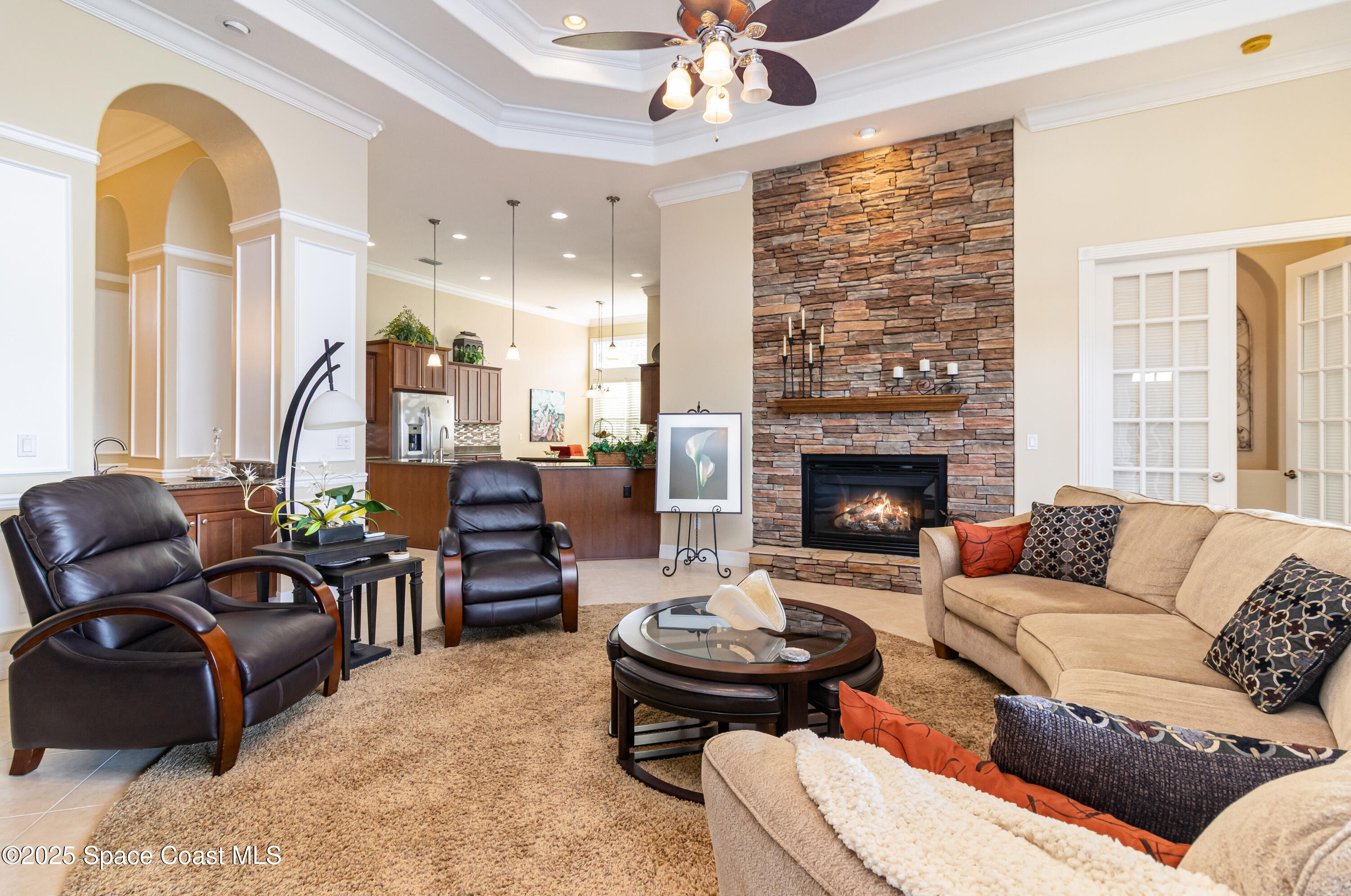 200 Harmony Lane Titusville, FL 32780 - Photo 8 of 28 a living room with furniture fireplace and a table