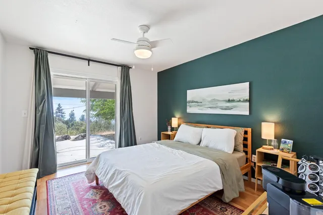 a bedroom with a bed and a chair