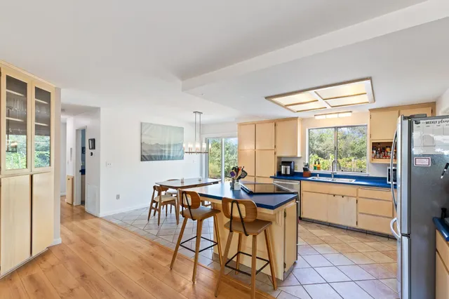 a bedroom with a large bed and a tv