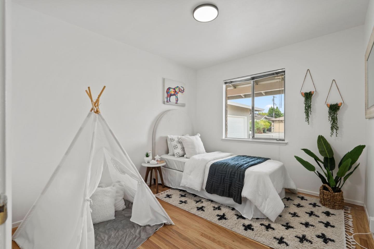 4840 Anna Drive San Jose, CA 95124 - Photo 4 of 5 a bedroom with a bed and a window