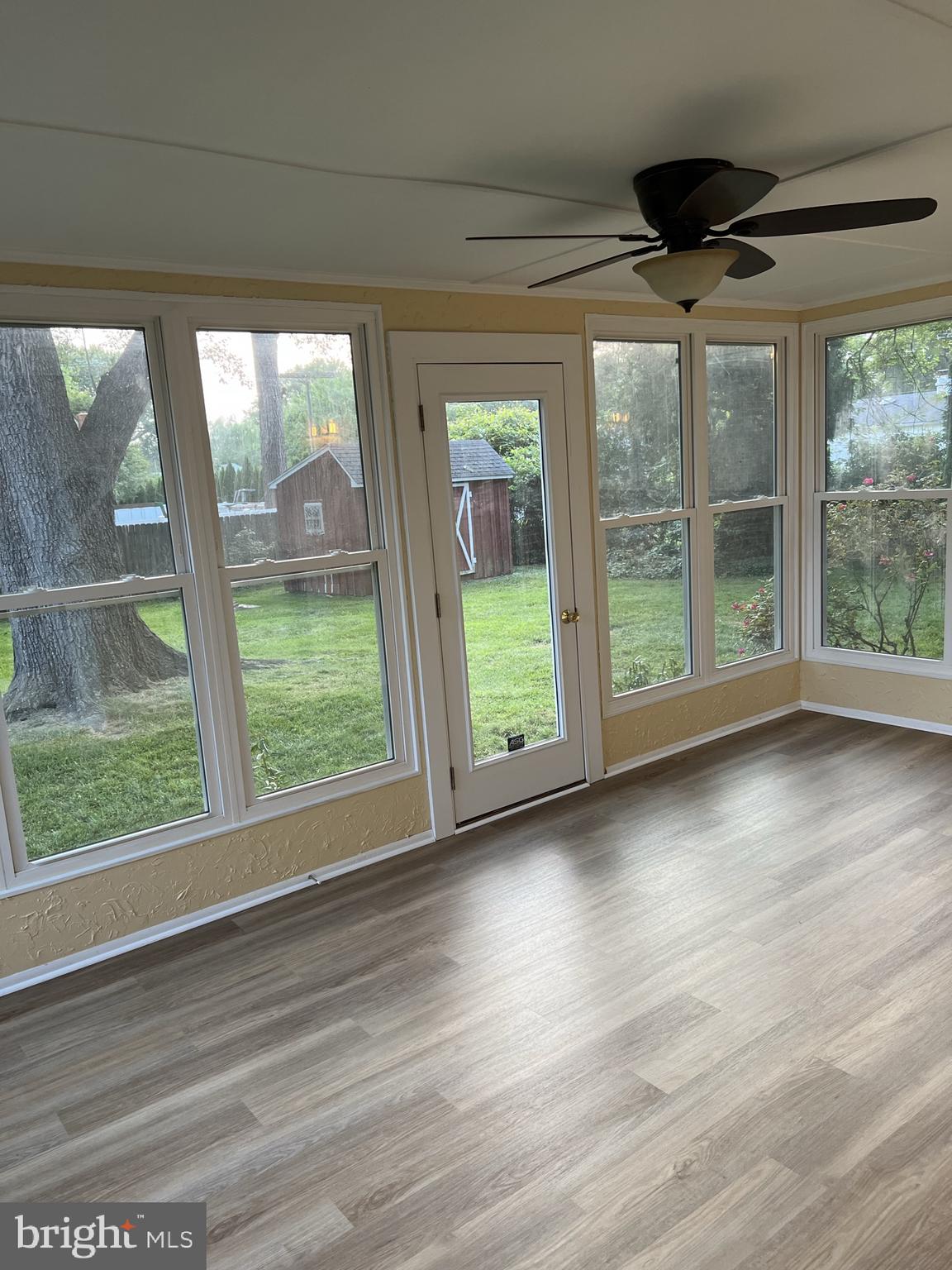 104 Cedar Street Chestertown, MD 21620 - Photo 7 of 14 a view of room with window and wooden floor