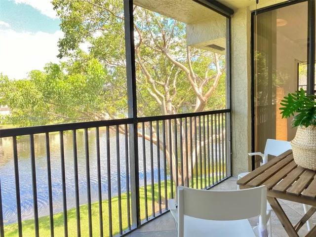 a view of balcony with wooden floor