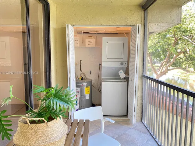 a porch with furniture and potted plant