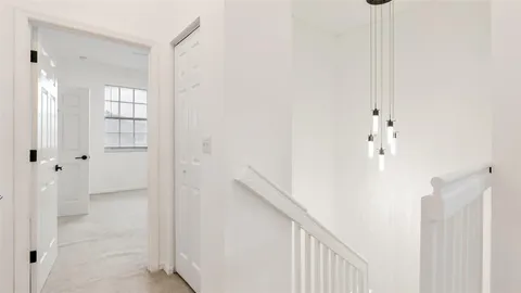 a view of hallway with stairs