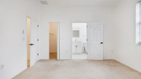 an empty room with closet area