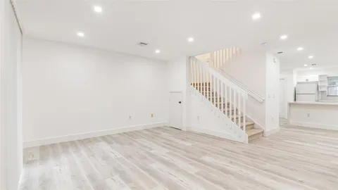 a view of entryway with wooden floor