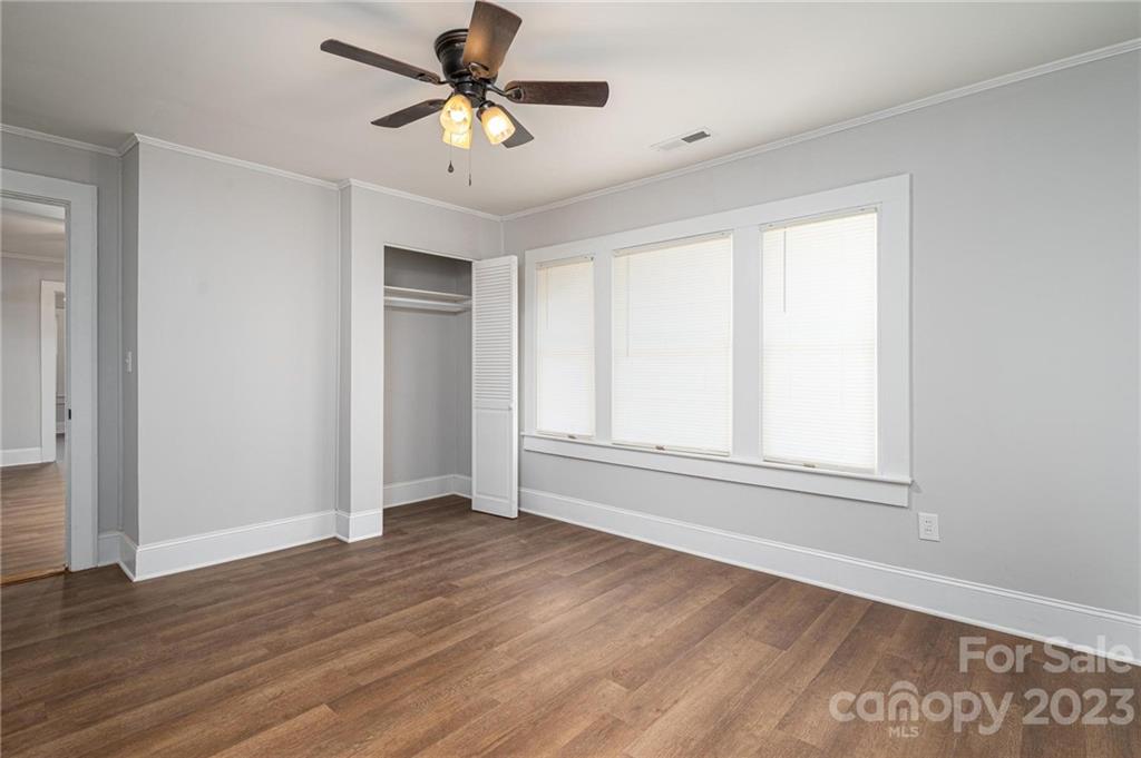 2496 Shoal Road Crouse, NC 28033 - Photo 15 of 29 a view of empty room with wooden floor and fan