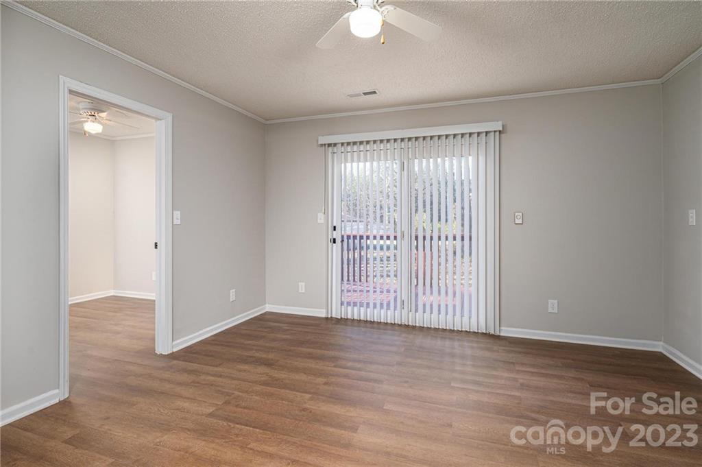 2496 Shoal Road Crouse, NC 28033 - Photo 16 of 29 a view of an empty room with wooden floor and a window
