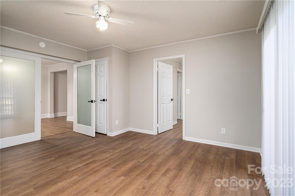 2496 Shoal Road Crouse, NC 28033 - Photo 17 of 29 wooden floor in an empty room with a window