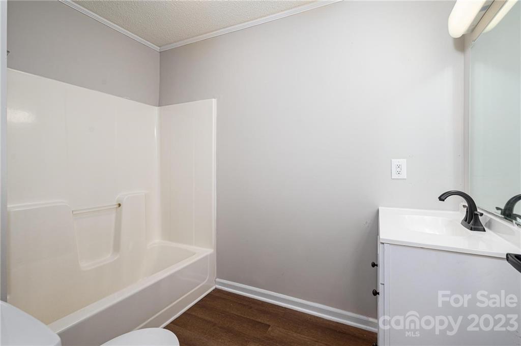 2496 Shoal Road Crouse, NC 28033 - Photo 18 of 29 a bathroom with a sink and a bathtub