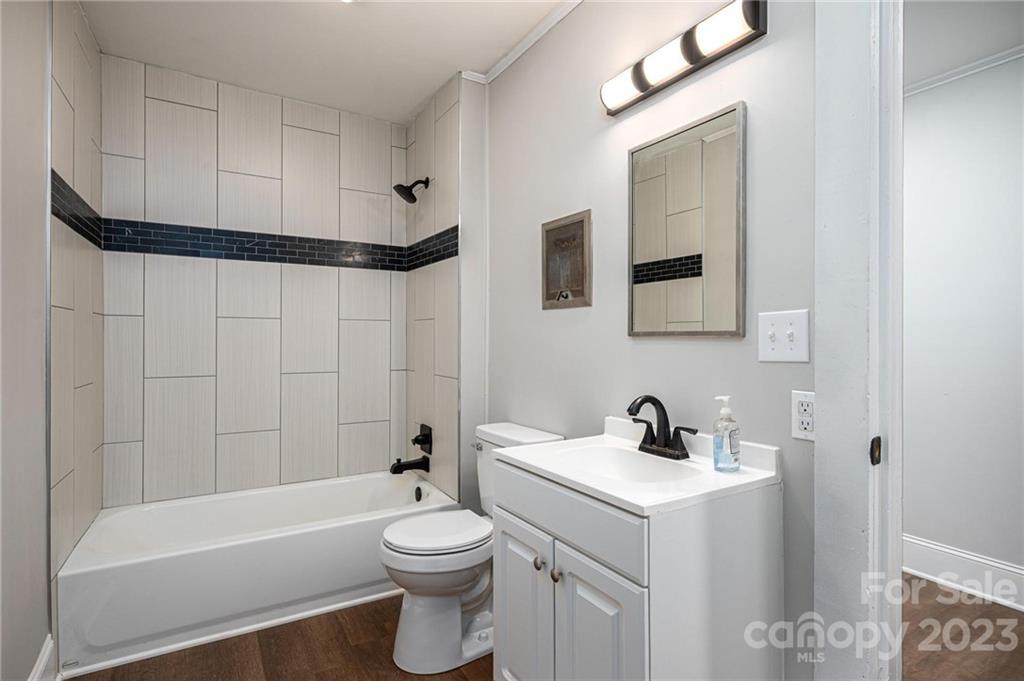 2496 Shoal Road Crouse, NC 28033 - Photo 22 of 29 a bathroom with a sink a toilet and shower