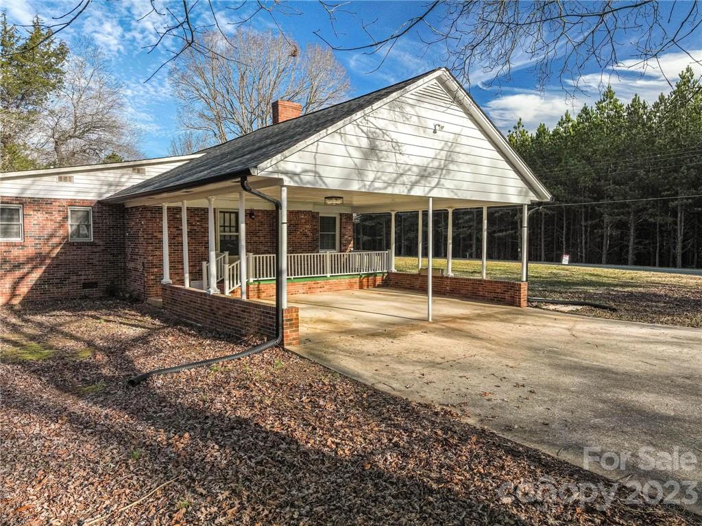 2496 Shoal Road Crouse, NC 28033 - Photo 24 of 29 a view of a house with a garden