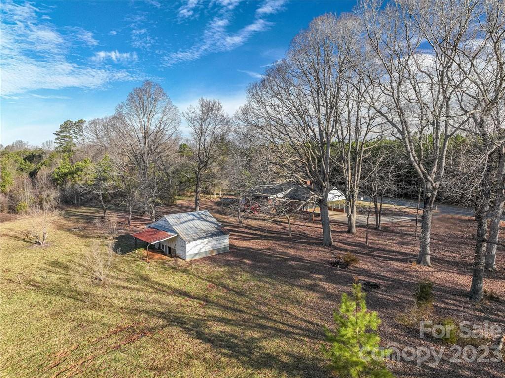 2496 Shoal Road Crouse, NC 28033 - Photo 25 of 29 a view of yard with tree and wooden fence