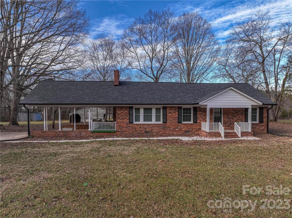 2496 Shoal Road Crouse, NC 28033 - Photo 4 of 29 a front view of a house with a yard