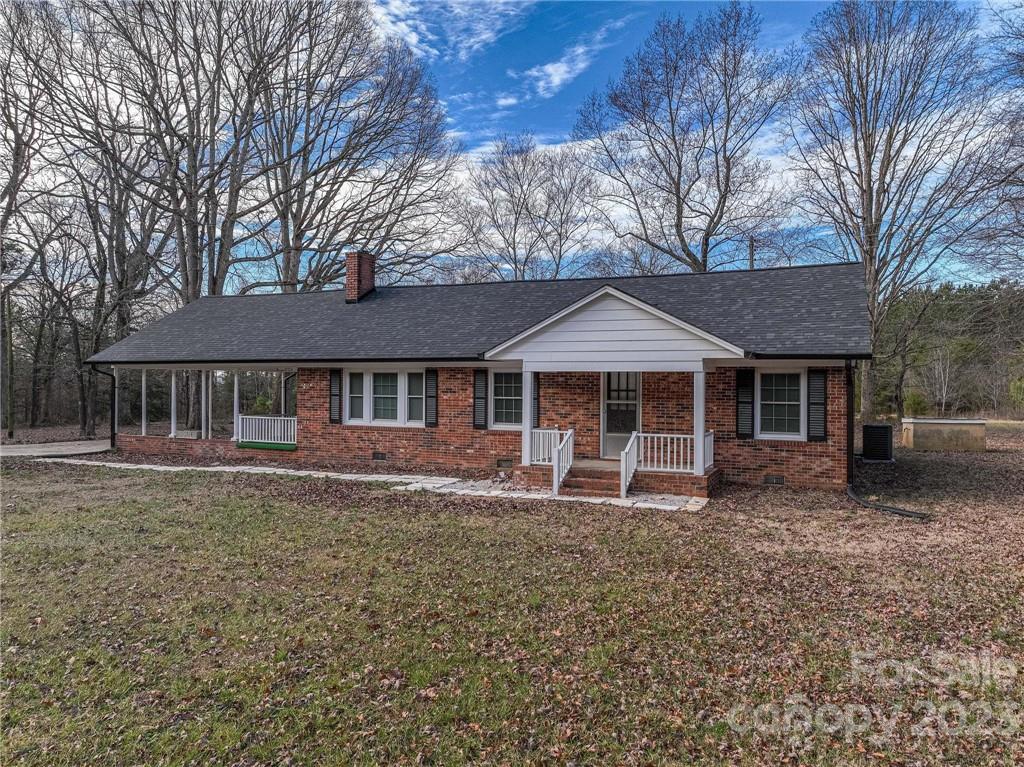 2496 Shoal Road Crouse, NC 28033 - Photo 6 of 29 a front view of a house with garden