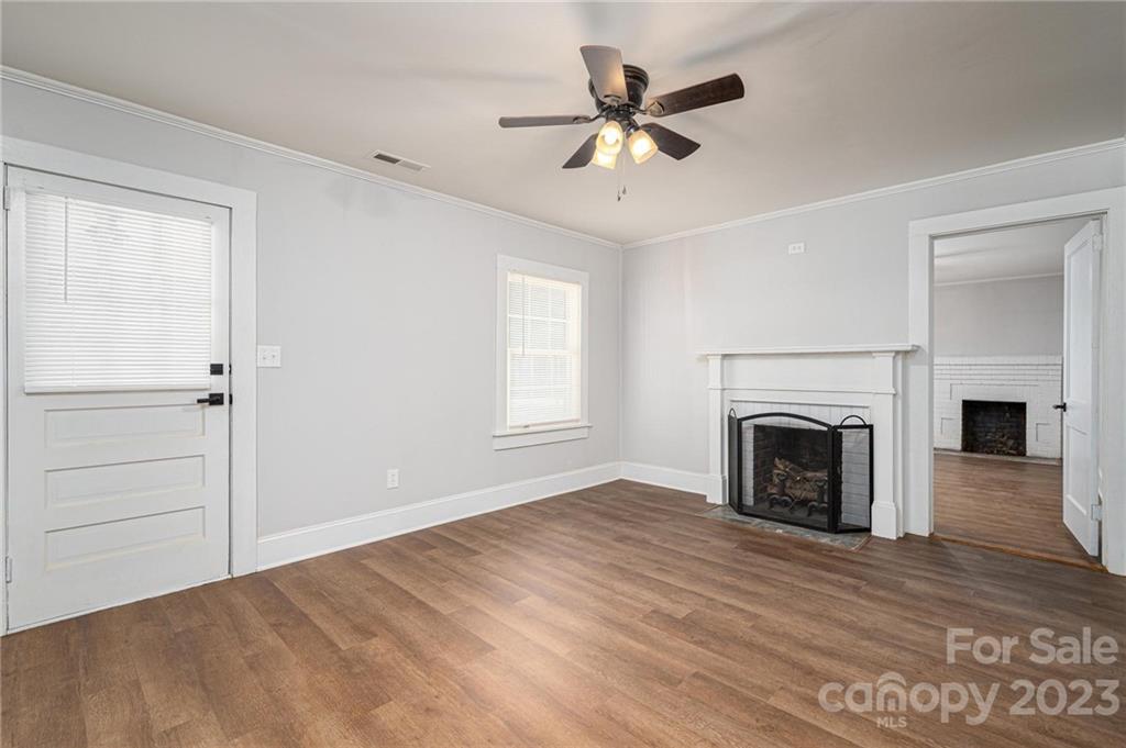 2496 Shoal Road Crouse, NC 28033 - Photo 8 of 29 an empty room with fireplace fan and windows