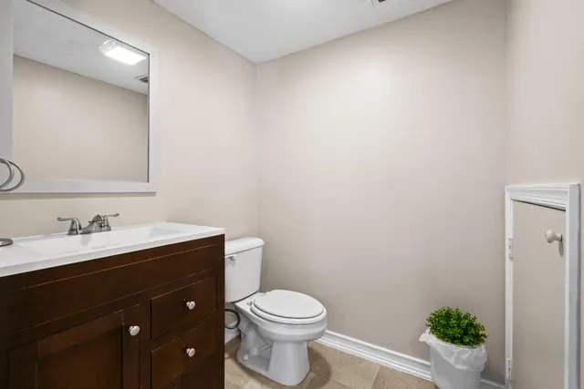 a view of washer and dryer with kitchen in the background