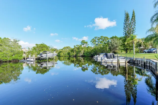 a view of a swimming pool with a deck and living room