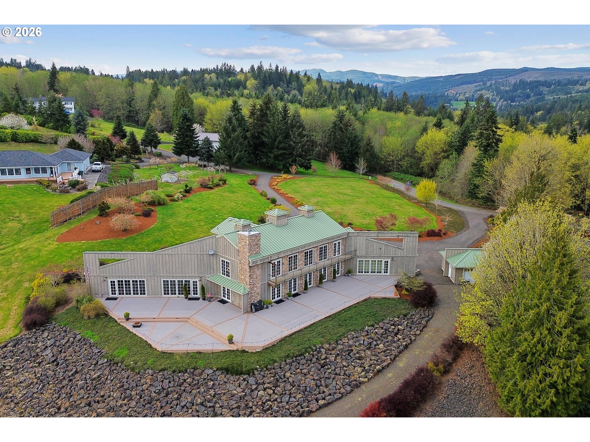 545 McAdams Road East Longview, WA 98632 - Photo 41 of 46 a view of a house with a yard and a garden