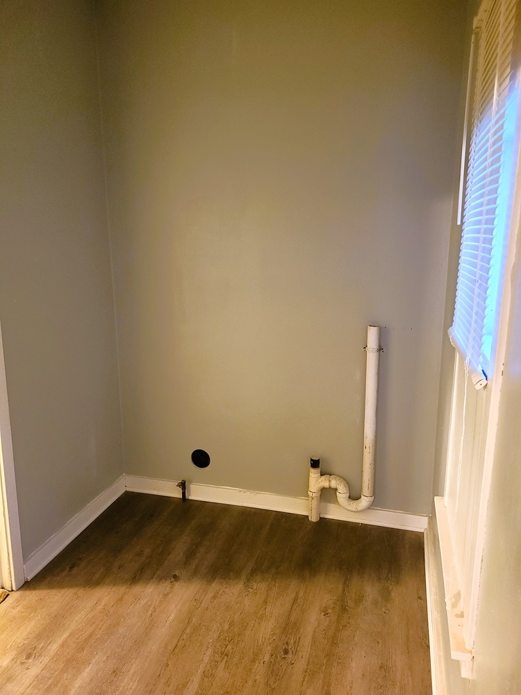 902 West 5th Street Sterling, IL 61081 - Photo 13 of 20 a view of a room with rack on the wall and a window