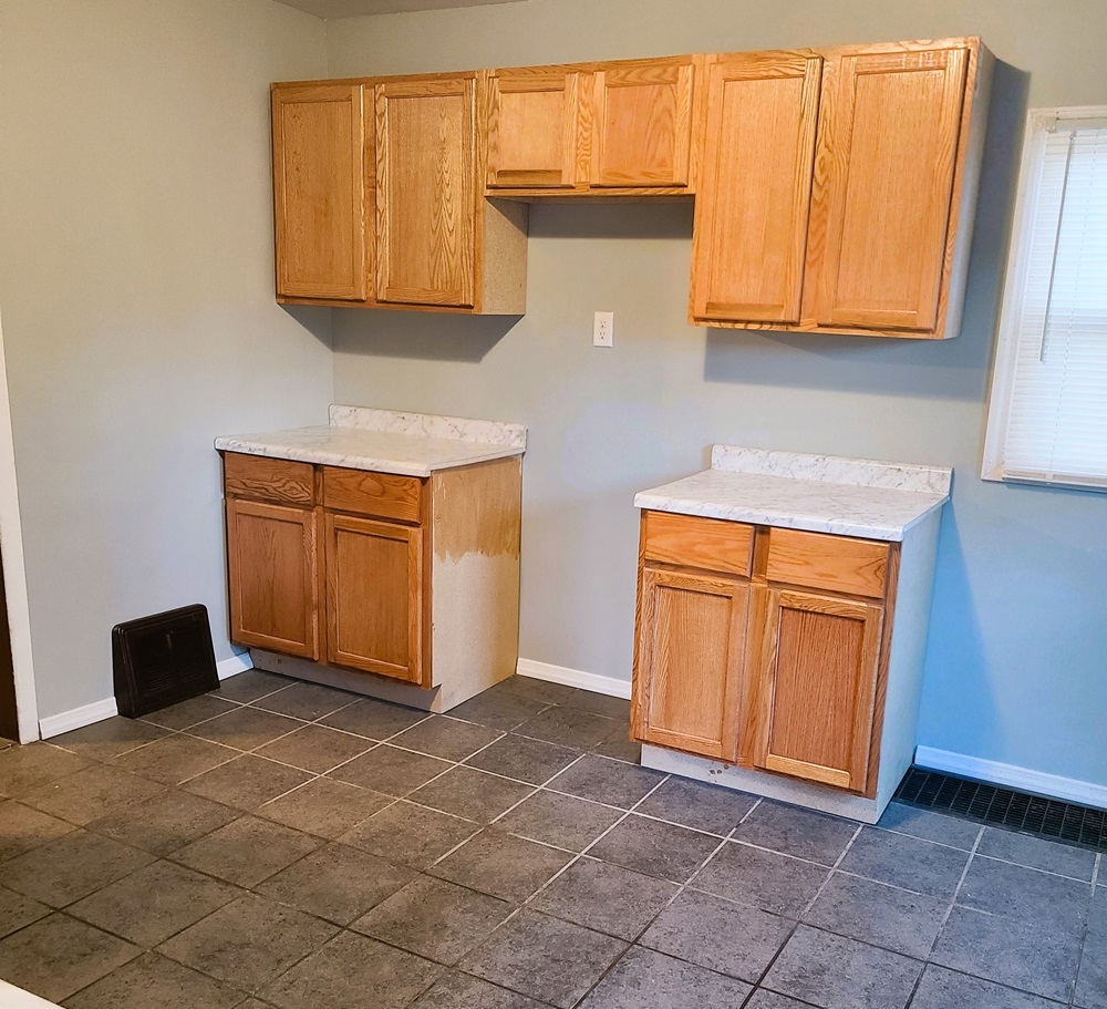 902 West 5th Street Sterling, IL 61081 - Photo 5 of 20 a view of an empty room with wooden floor