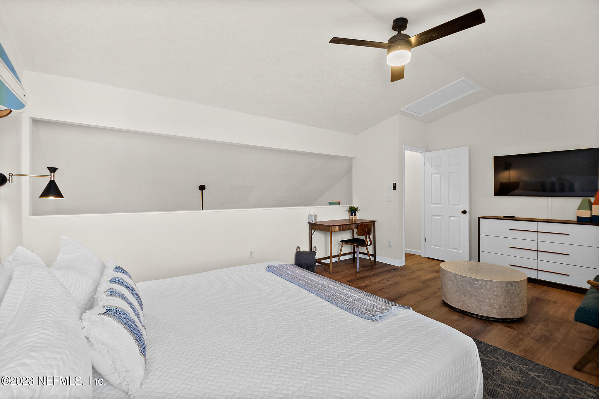 3905 Windjammer Lane St. Augustine, FL 32084 - Photo 21 of 40 a bedroom with furniture and a flat screen tv