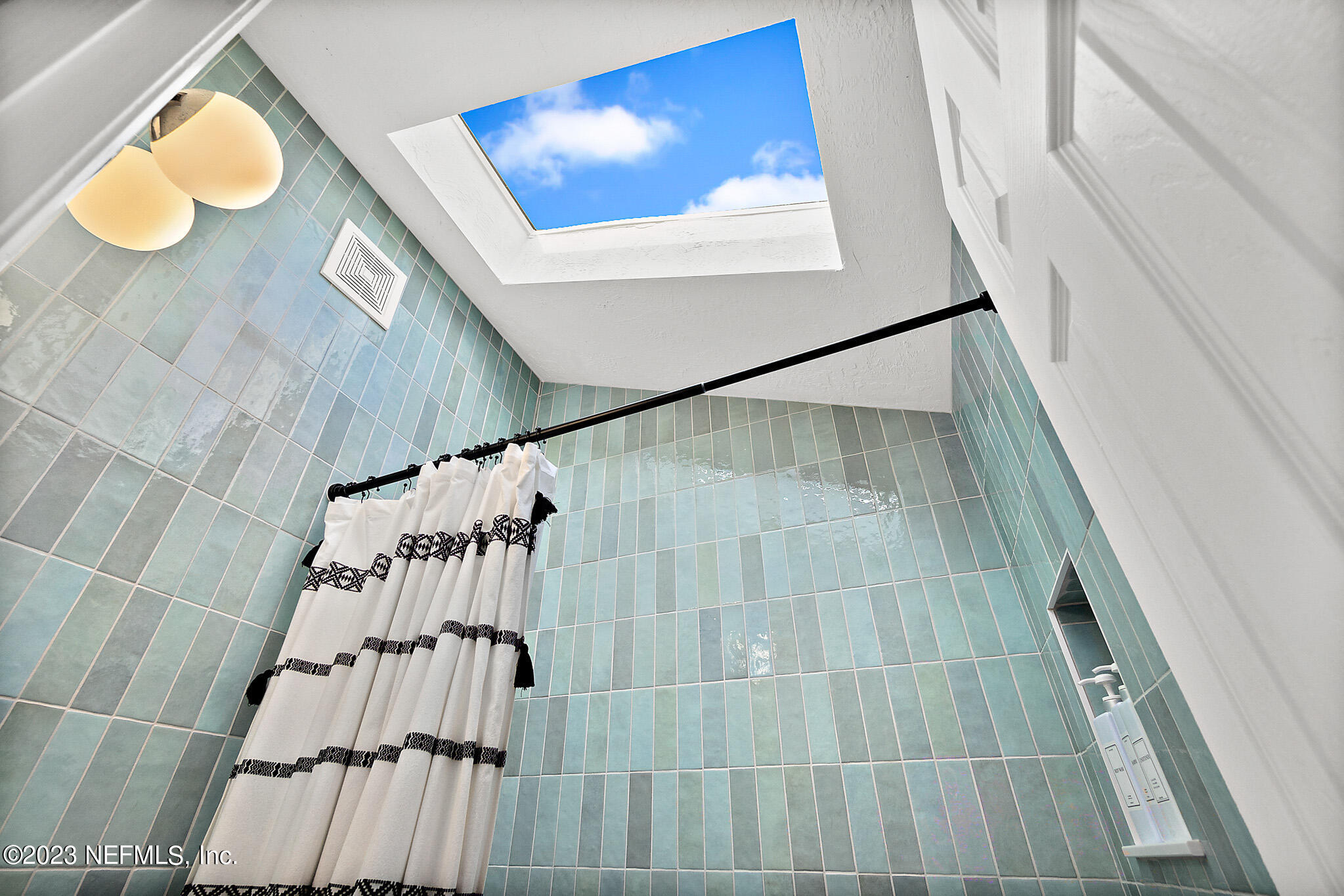 3905 Windjammer Lane St. Augustine, FL 32084 - Photo 24 of 40 a bathroom with a sink and mirror