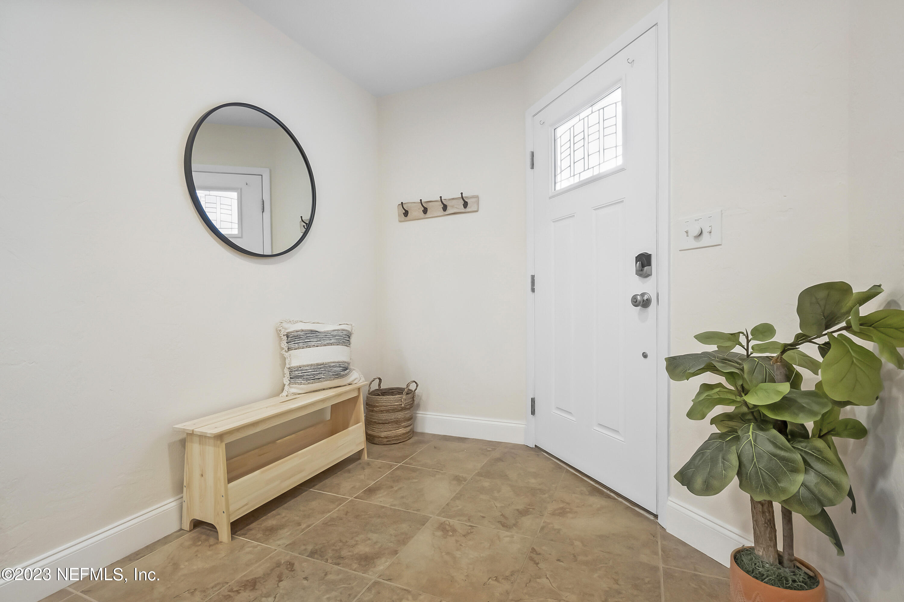 3905 Windjammer Lane St. Augustine, FL 32084 - Photo 5 of 40 a room with wooden floor and a potted plant
