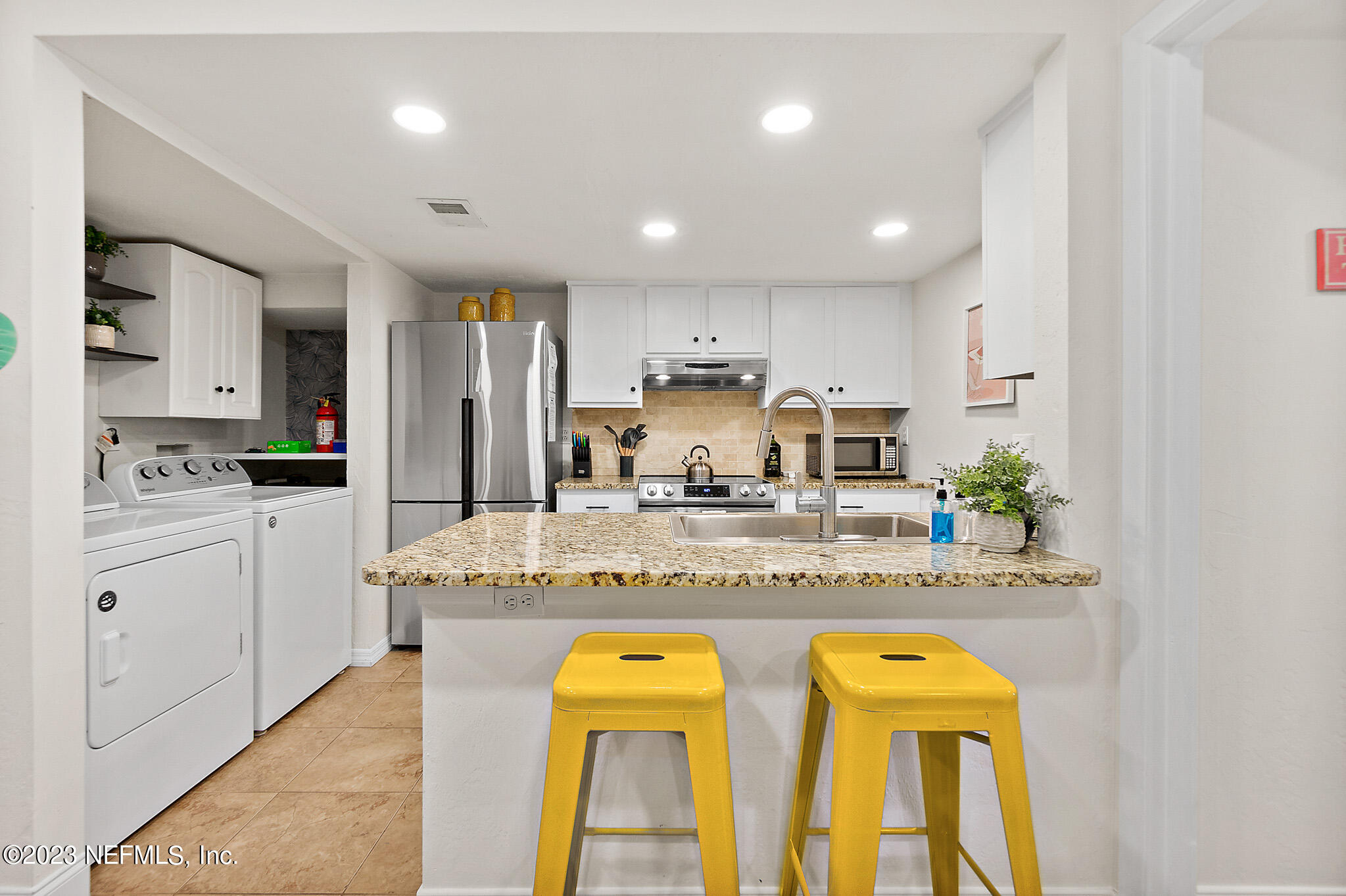 3905 Windjammer Lane St. Augustine, FL 32084 - Photo 9 of 40 a kitchen with counter top space cabinets and appliances
