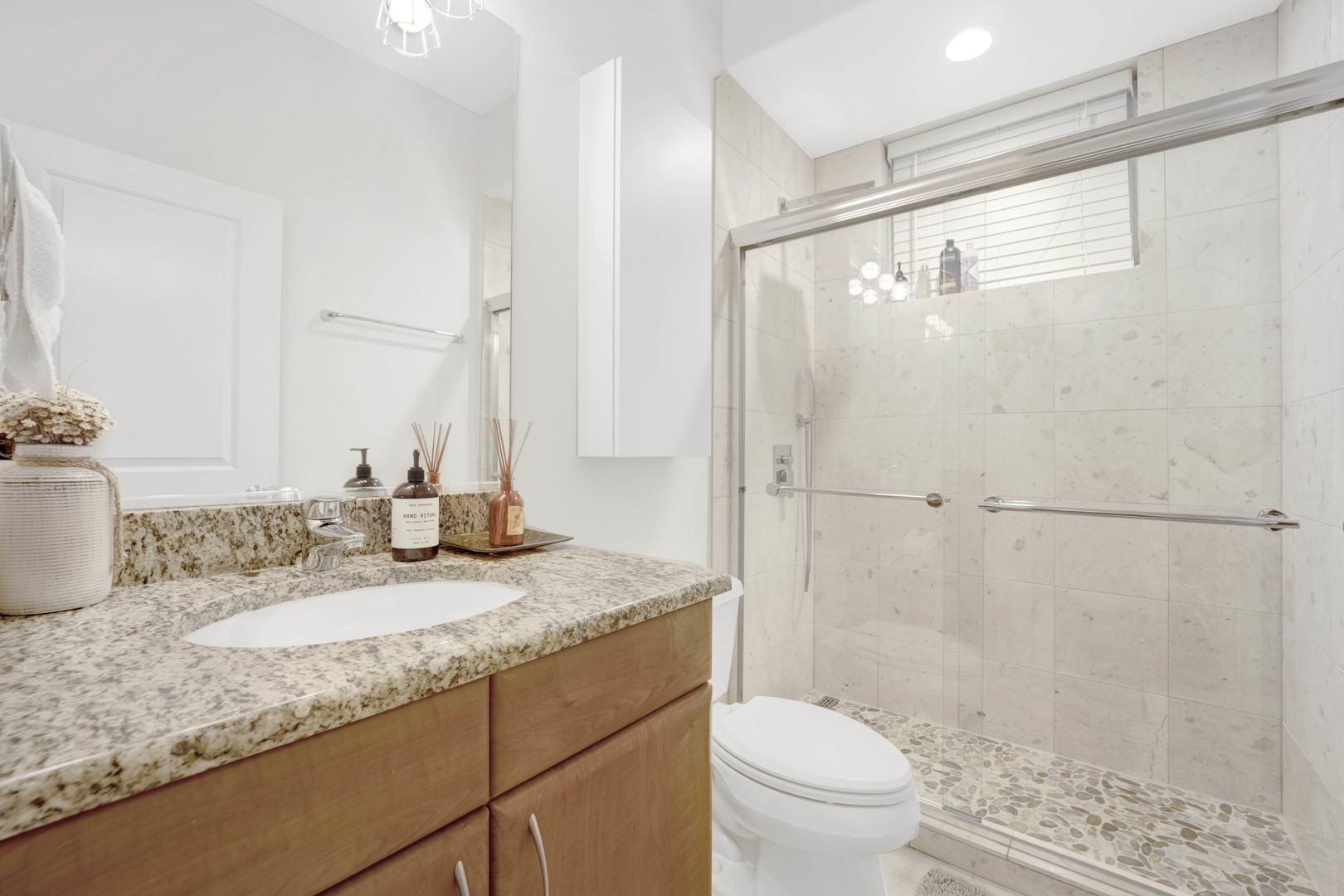 1531 West Fry Street, Unit 1 Chicago, IL 60642 - Photo 23 of 25 a bathroom with a granite countertop sink toilet and shower