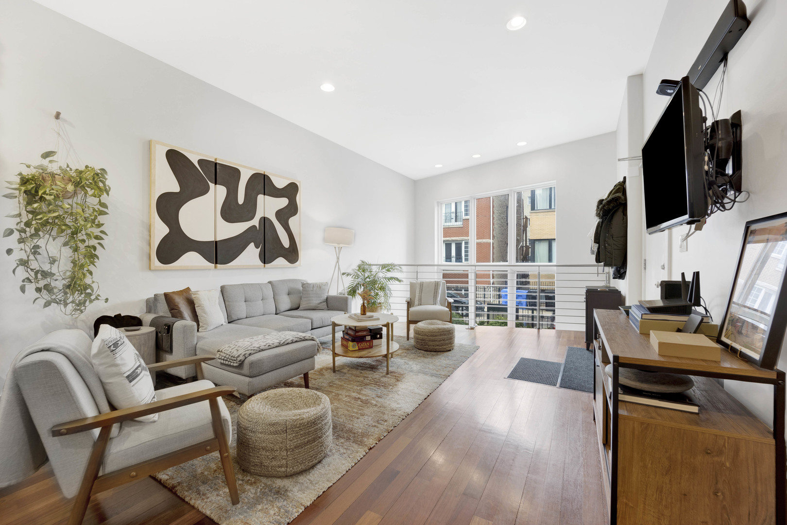 1531 West Fry Street, Unit 1 Chicago, IL 60642 - Photo 3 of 25 a living room with furniture and a flat screen tv