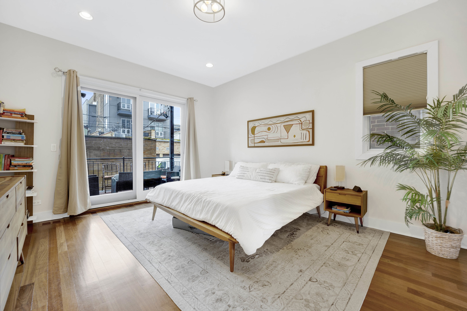 1531 West Fry Street, Unit 1 Chicago, IL 60642 - Photo 10 of 25 a spacious bedroom with a bed and a large window
