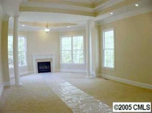 3276 Millstone Creek Road Lancaster, SC 29720 - Photo 7 of 8 a view of an empty room with a fireplace and a window