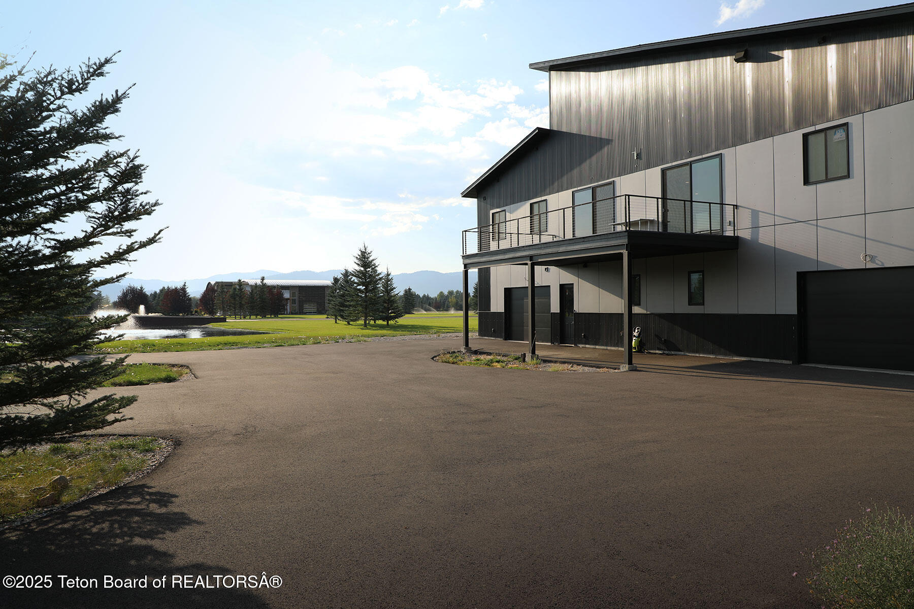 868 Diamandis Drive Alpine, WY 83128 - Photo 25 of 37 868_Diamandis_Drive_Hangar_Back_Ext