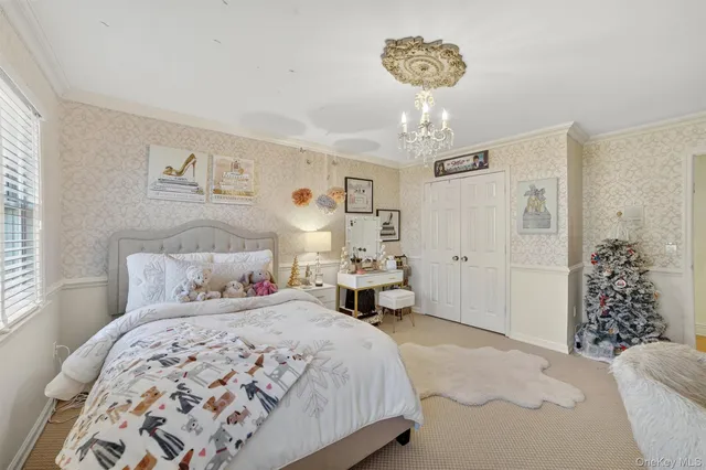 a spacious bedroom with a large bed and a flat screen tv