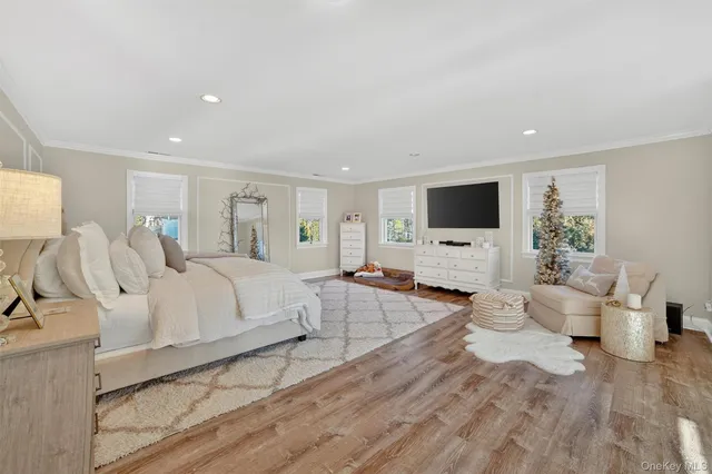 a spacious bedroom with a large bed and a couch