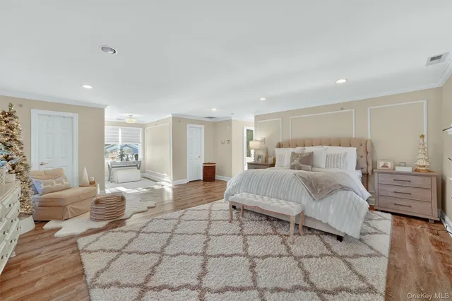 a spacious bathroom with a bathtub and chandelier