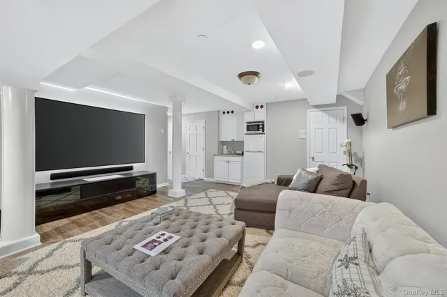 a view of a room with furniture and windows