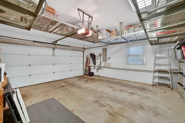 a view of house with deck and outdoor seating