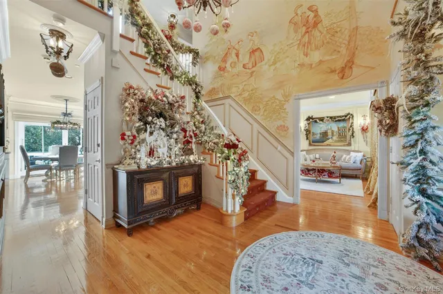 a living room with fireplace furniture and a wooden floor